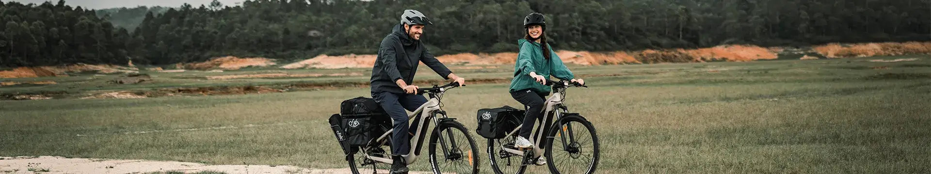 A couple rides a Fiido electric bicycle around town.