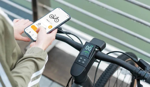 A woman is using the Fiido APP to connect a Fiido e-bike.