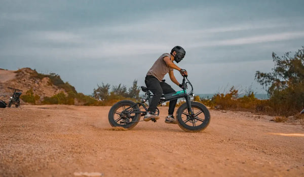 A man rides a Fiido M1 pro electric bike off-road