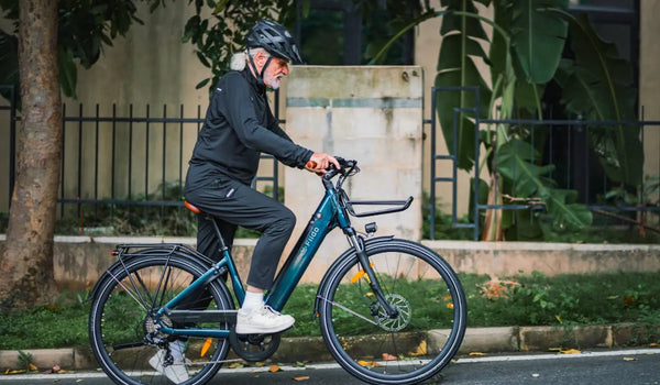 A man rides the FIIDO C11 Pro City electric bike through the neighborhood.