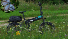 A Fiido M1 Pro fat tire electric bike was temporarily placed in the grass.