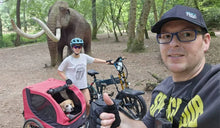 A couple is enjoying a ride in the park on the FIIDO M1 Pro electric bike and the Fiido Titan electric bike.