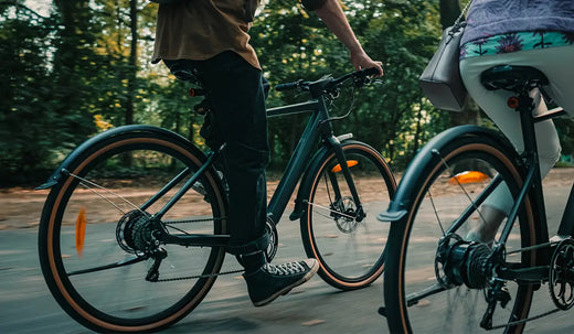 A couple enjoying a ride on Fiido electric bicycles.