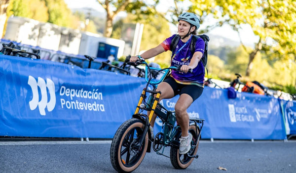 World Triathlon 2026 staff member riding a Fiido M1 Pro e-bike in Pontevedra, Spain