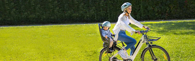 Mother riding a Fiido C11 electric bike with her child